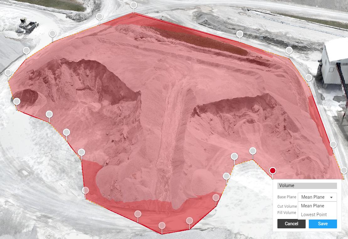 Aerial view of stockpiles being measured by a drone